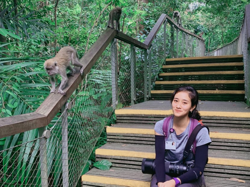 The author with long-tailed macaques at Windsor Nature Park in 2019.