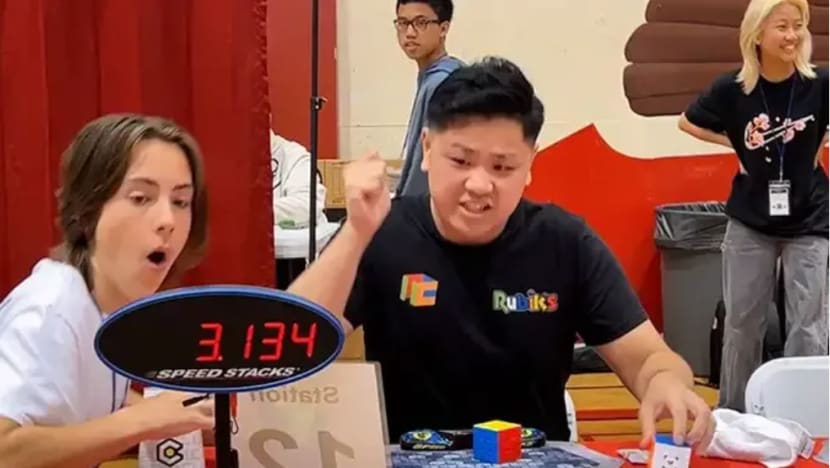 Solved in 3.13 seconds 21 year old breaks Rubik s Cube world record CNA
