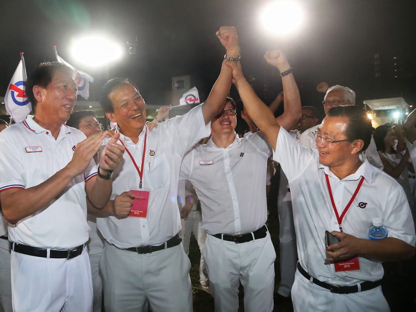 Mr Chong (second from left) being congratulated by his PAP colleagues at Bedok Stadium. The veteran MP thanked the WP’s Ms Lee Li Lian for taking care of the constituency. Photo: Ooi Boon Keong
