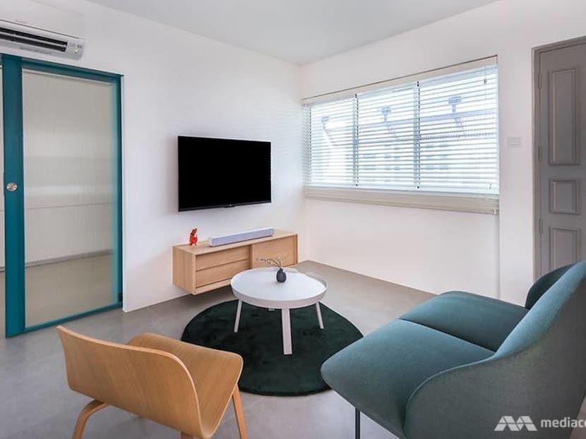 A girlfriend-approved HDB 'man cave' with room for comics, gaming and fast cars