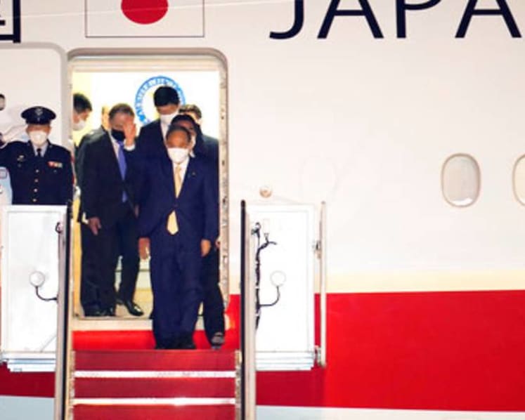 Japan PM Suga arrives in US for China-focused talks with Biden