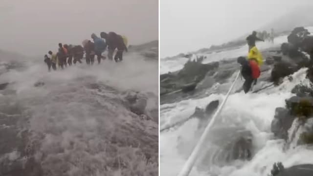 神山突降暴雨 登山者激流中紧抓绳索下山