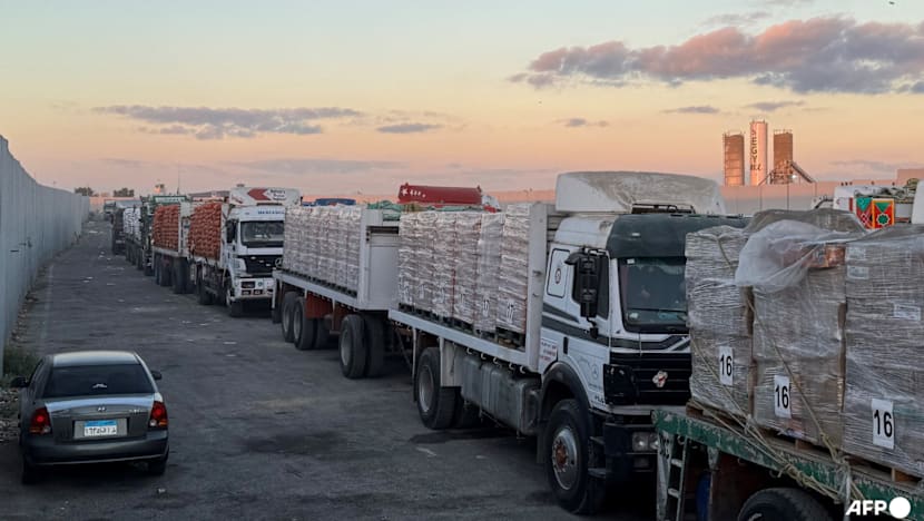 Aid trucks roll into Gaza as dispute over hostage bodies pauses