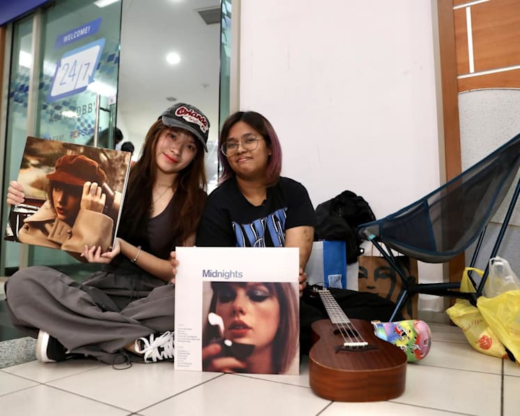 'Anything to breathe the same air as Taylor': Queues form outside post offices as Swifties vie for concert tickets