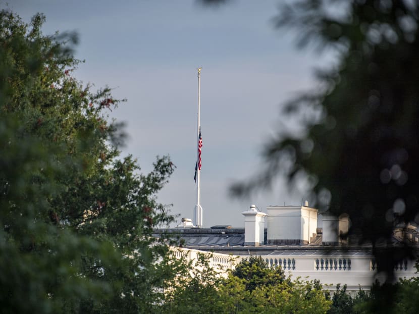 The US flag flies at half mast over the White House after US President Joe Biden delivered remarks in Washington, DC, on August 26, 2021 on the terror attack at Hamid Karzai International Airport, and the US service members and Afghan victims killed and wounded.