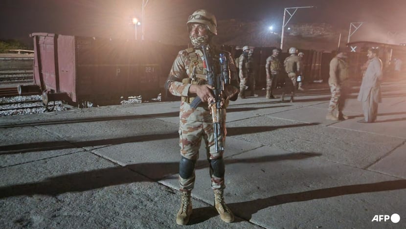 Pakistan insurgents take dozens of hostages in attack on train, police say