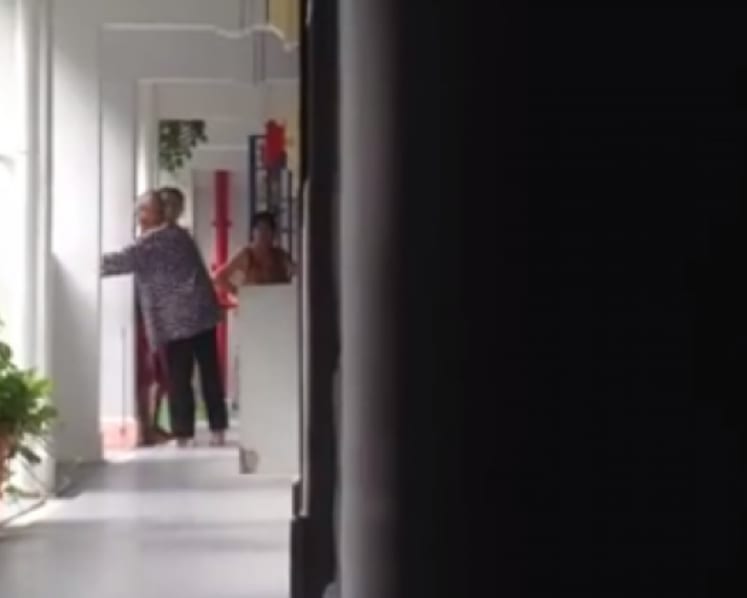 Man in abuse video charged with abetting neighbour