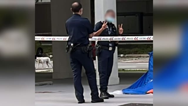 警员在坠楼现场比不恰当手势 警方道歉并处分