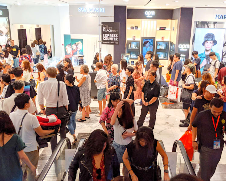 Rain did not deter shoppers who made a beeline for Black Friday discounts on Orchard Road