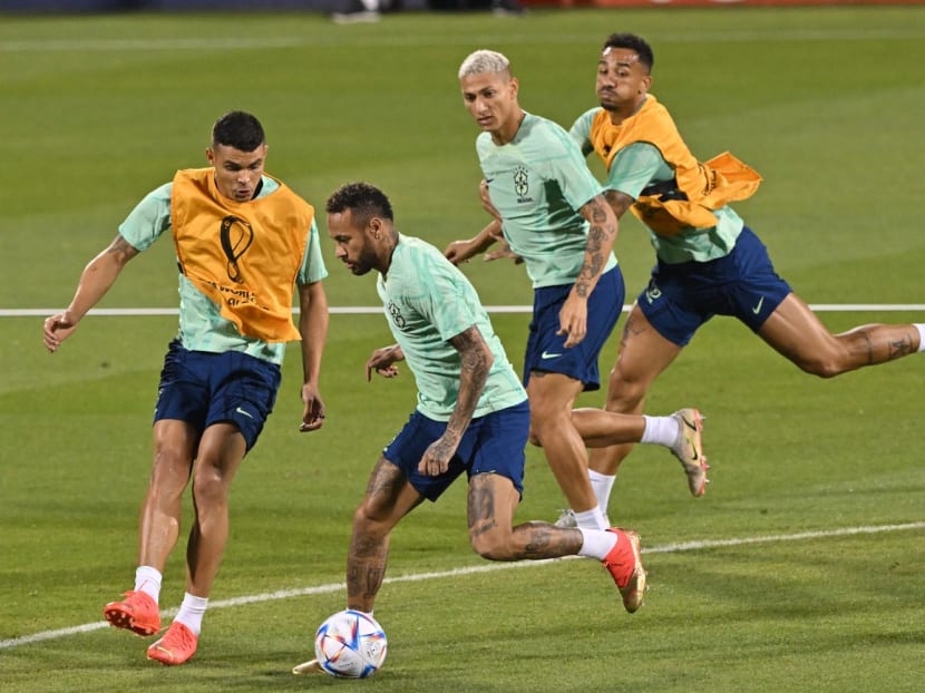 Brazil's forward Neymar (second left) takes part in a training session with teammates at the Al Arabi SC Stadium in Doha on Dec 4, 2022, on the eve of the Qatar 2022 World Cup football match between Brazil and South Korea.
