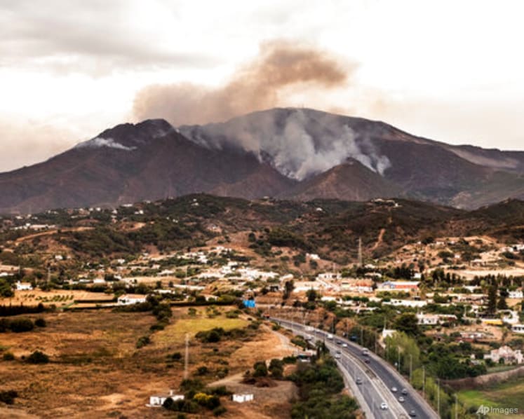 Rainfall helps firefighters control southern Spain's inferno