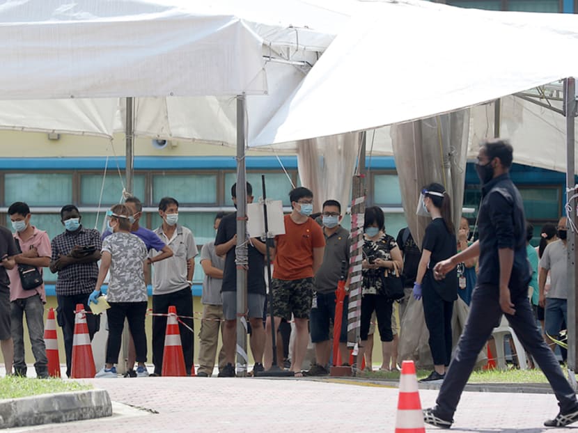 People queuing to take a swab test at a screening centre at the former Coral Primary School on May 23, 2021.