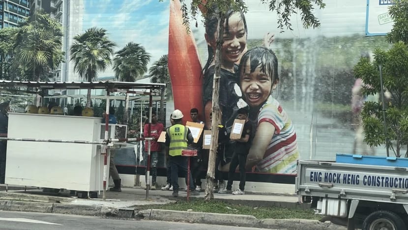 Two to be charged for instructing foreign workers to hold placards in illegal protests Two to be charged for instructing foreign workers to hold placards in illegal protests