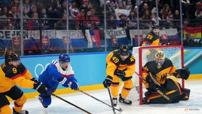 Ice hockey-Slovakia muscle past Germany into semi-finals