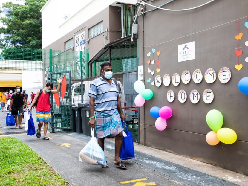 Migrant workers who have recovered from Covid-19, or tested negative twice, returning to Westlite Toh Guan Dormitory on June 12, 2020.