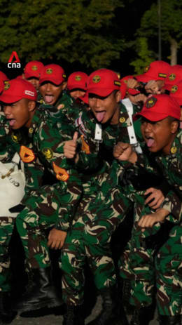 Indonesian soldiers perform battle cry during Bastille Day rehearsal in Paris