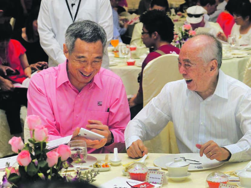 File photo of Wee Cho Yaw (right) with Prime Minister Lee Hsien Loong at an anniversary dinner in 2012.