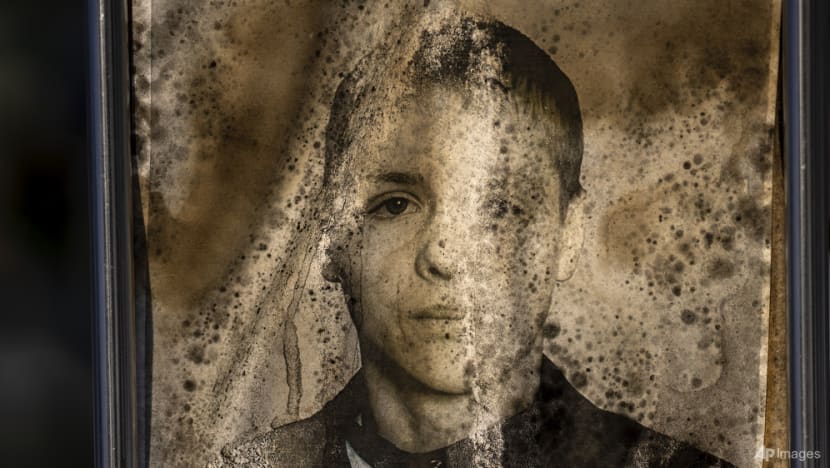 In pictures: The fading graveside portraits of Ukraine's war dead