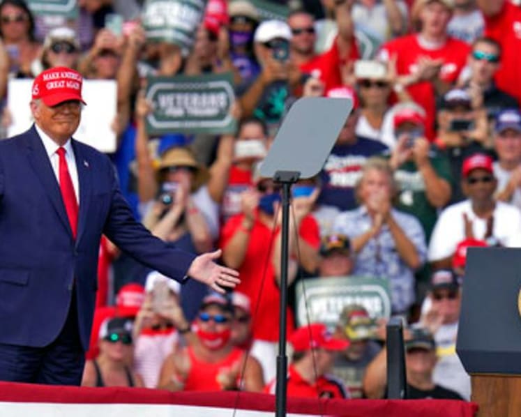 As COVID-19 surges, Trump rallies keep packing in thousands  