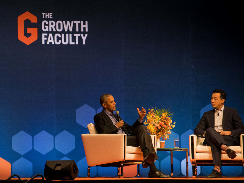Former United States president Barack Obama speaking on Monday (Dec 16) at a dialogue event at Singapore Expo Convention Hall and Exhibition Centre, with moderator, Mr Nicholas Fang.
