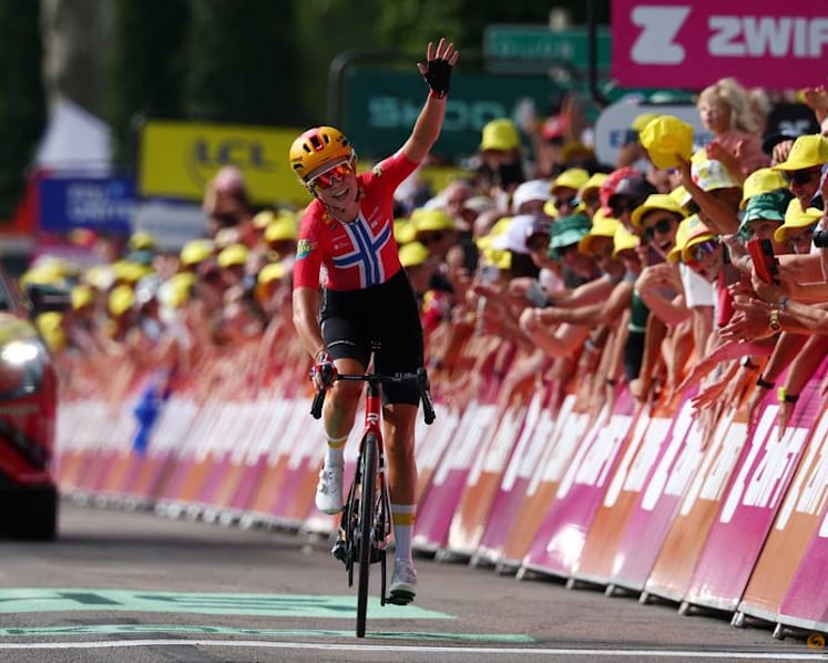 Norwegian Haugset rides to solo victory to take yellow jersey in Tour de France Femmes