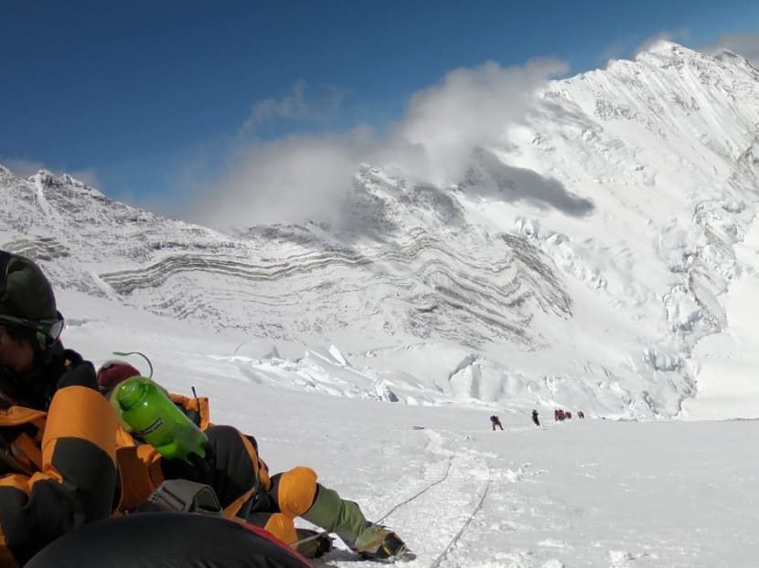 In this photo taken on May 17, 2018, mountaineers and sherpas gather at the summit of Mount Everest after ascending on the south face from Nepal.