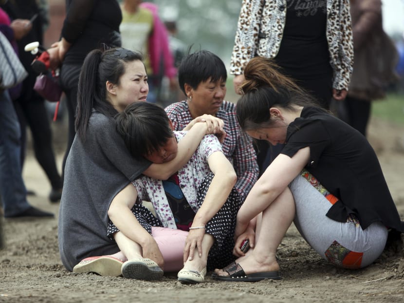 Gallery: China farm fire: Relatives scuffle with police, demand answers