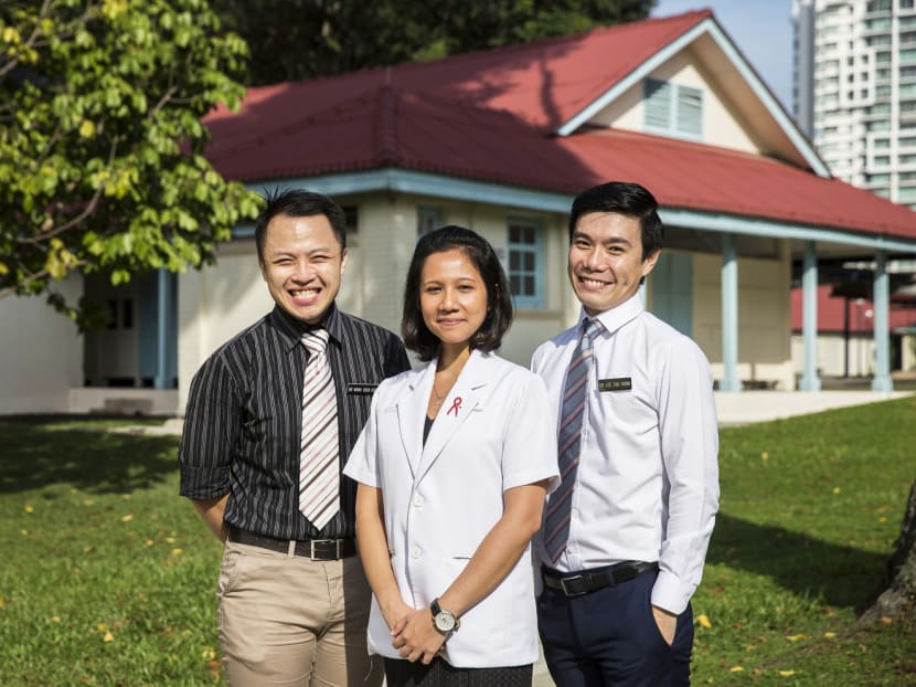 Working with HIV patients are TTSH staff from the Institute of Infectious Diseases and Epidemiology, (from left) consultant Dr Wong Chen Seong, senior medical social worker Ms Amanda Yap and associate consultant Dr Lee Tau Hong. PHOTO: NURIA LING