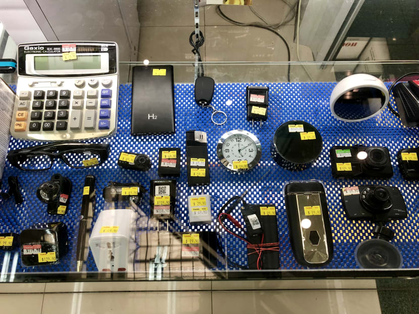 Spy cameras masqueraded as everyday items, such as power banks and calculators, on sale at a store in Sim Lim Square in 2018.