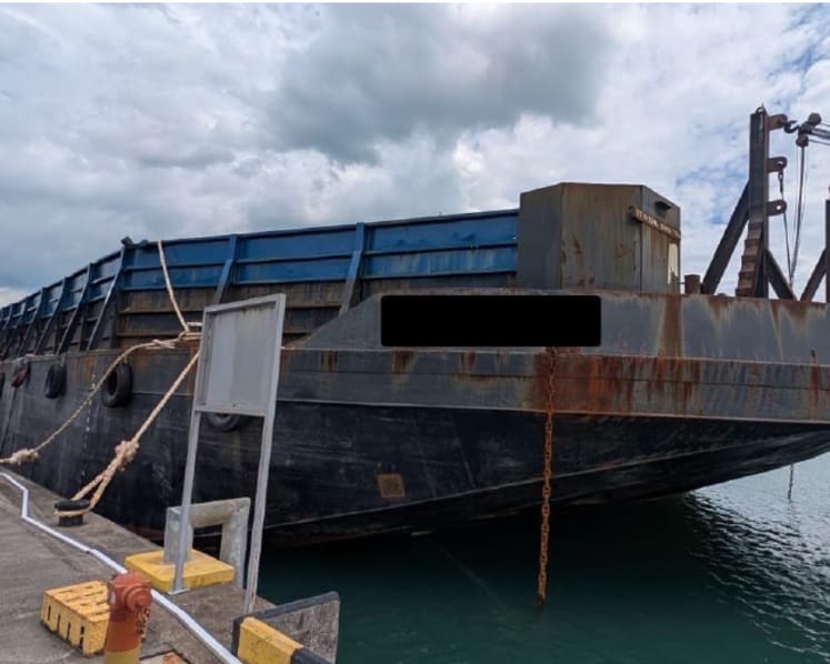Indonesian man charged with helping 3 people hidden on barge enter Singapore illegally