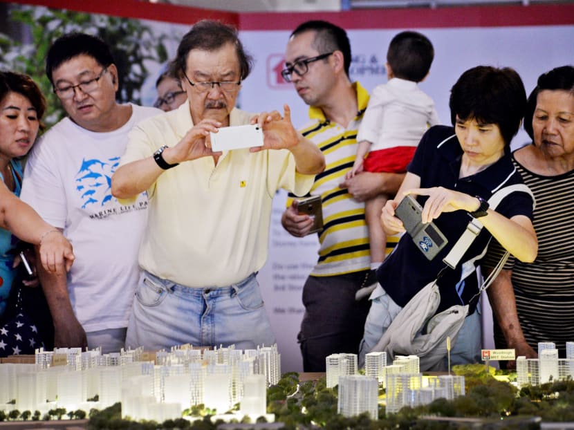 Potential HDB home-owners viewing a diorama of the upcoming Bidadari BTO estate at the HDB Hub. TODAY file photo