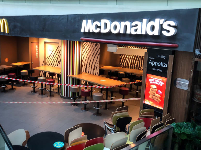 McDonald's outlets across Singapore, including this one at Chinatown Point, will remain closed for a little longer after May 5, which the fast-food chain had previously stated was the reopening date.