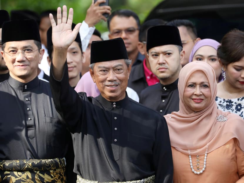 Mr Muhyiddin Yassin waves to reporters before his inauguration as the 8th prime minister, outside his residence in Kuala Lumpur, Malaysia, March 1, 2020.