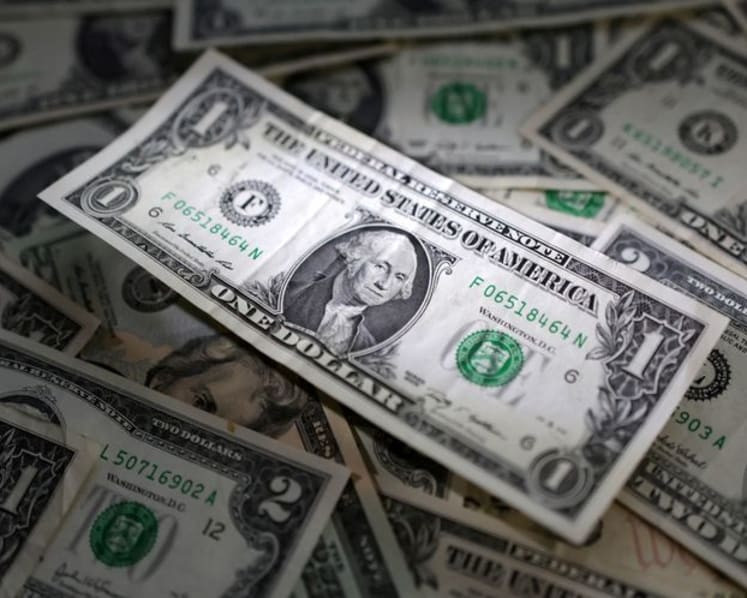 Dollar gains against peers with investors eyeing upcoming data