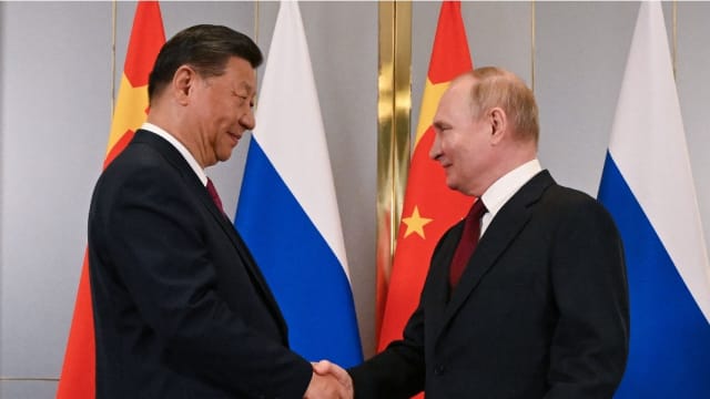 普京习近平会晤 赞俄中关系正值历来最好时期
