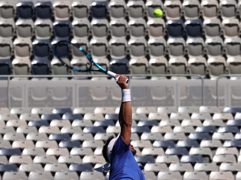 Italy's Fabio Fognini hits a return against France's Benoit Paire during their group C men's singles tennis match on day two of the 2021 ATP Cup in Melbourne on Feb 3, 2021. Italy's Fabio Fognini hits a return against France's Benoit Paire during their group C men's singles tennis match on day two of the 2021 ATP Cup in Melbourne on Feb 3, 2021.