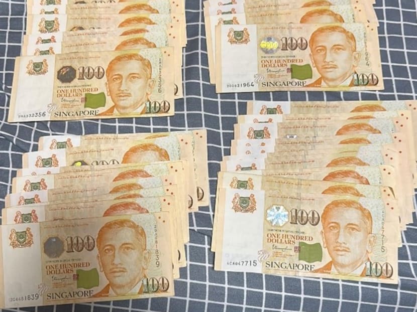 A photo showing cash seized by the police as case exhibits.