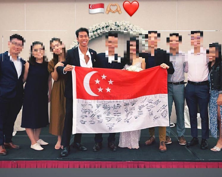 #trending: Photo of Mister Singapore with national flag that had scribbles raises eyebrows