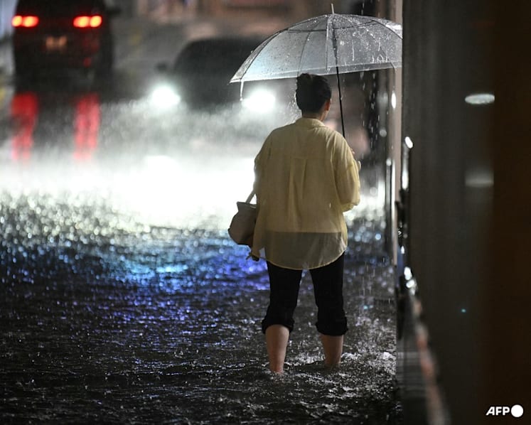 Record rain in Japan kills four, leaves thousands stranded at Narita airport