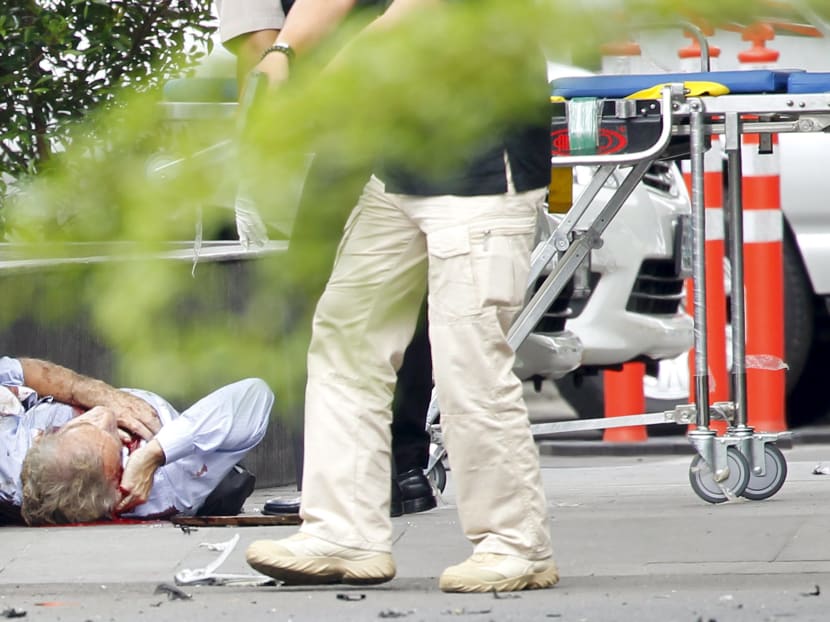 Seven dead in Jakarta blasts, gunfight