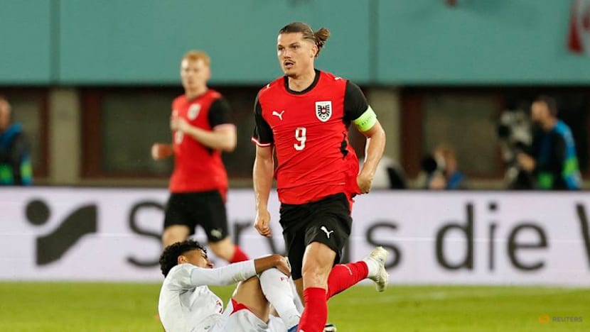 Austria fight back from early red card to beat Tunisia