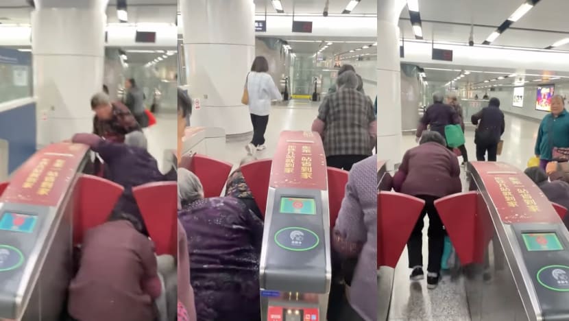 Grandmas In China Seen Crawling Under Gantry To Avoid Paying Train Fares Grandmas In China Seen Crawling Under Gantry To Avoid Paying Train Fares