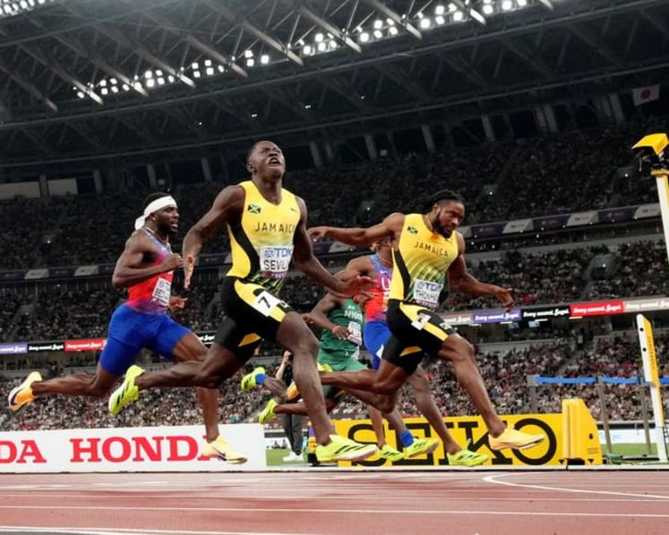 Seville delivers in style for world 100 metres gold