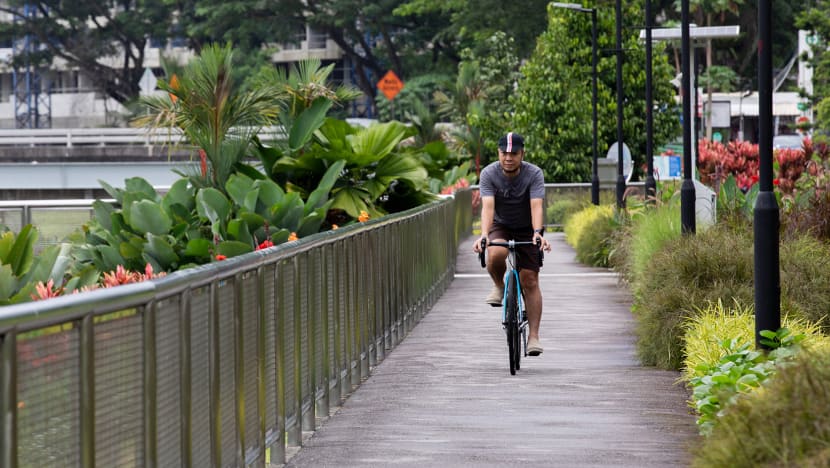 Father-of-three whose wife has cancer cycles 500km to raise S$51,000 for NCIS Cancer Fund