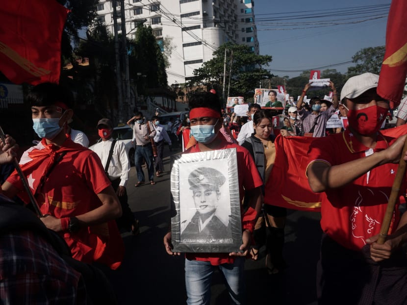 Protesters take part in a demonstration against the military coup in Yangon on February 9, 2021.