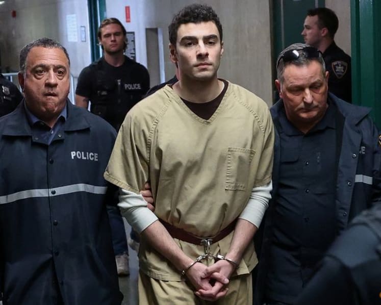 Luigi Mangione wins dismissal of terrorism counts over killing US health insurance executive  