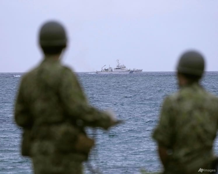 Debris found in search for missing Japanese army helicopter with 10 crew on board 