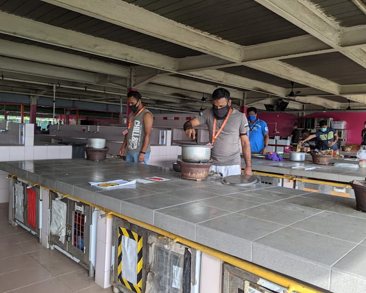 Migrant workers get back to cooking and daily runs after communal activities resume in dorms
