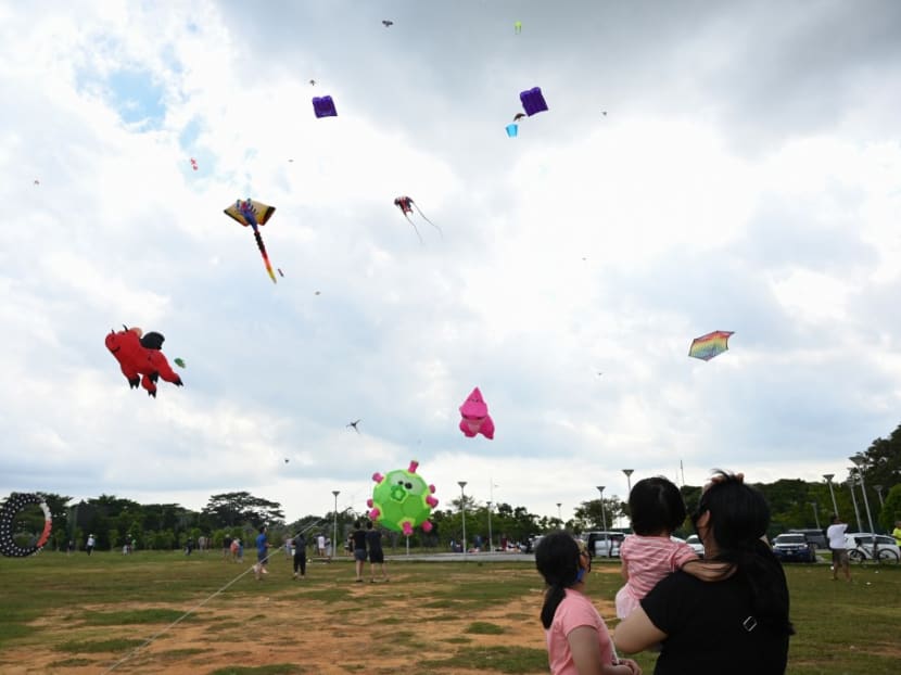 People fly kites on the open field at Marina Barrage in Singapore on Dec 27, 2020.
