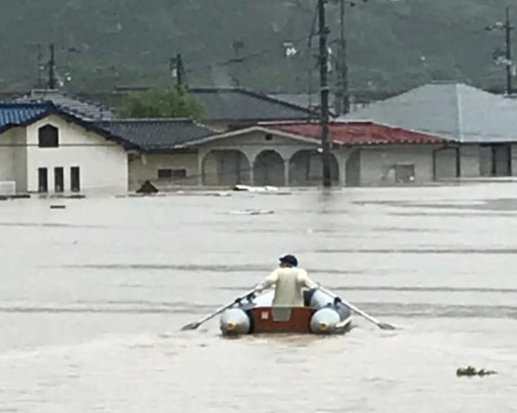 Japan's flood hero: 20 lives saved in a blow-up boat